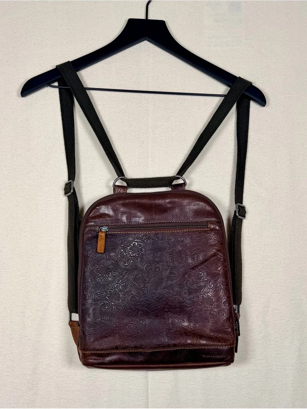 Jack Georges Voyager Convertible Backpack with embossed floral buffalo leather